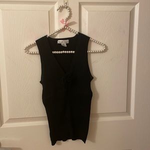 Black knit top with flower detail